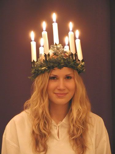 Swedish girl as Saint Lucia wearing a crown of candles