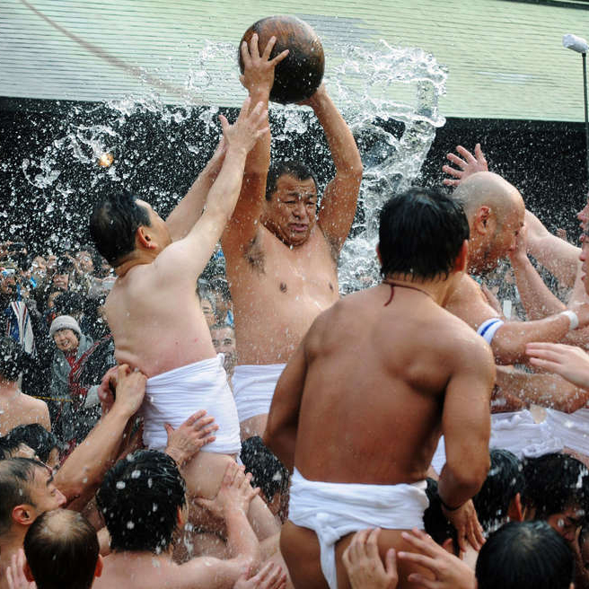 Men compete for a treasure ball at Tamaseseri Festival in Japan