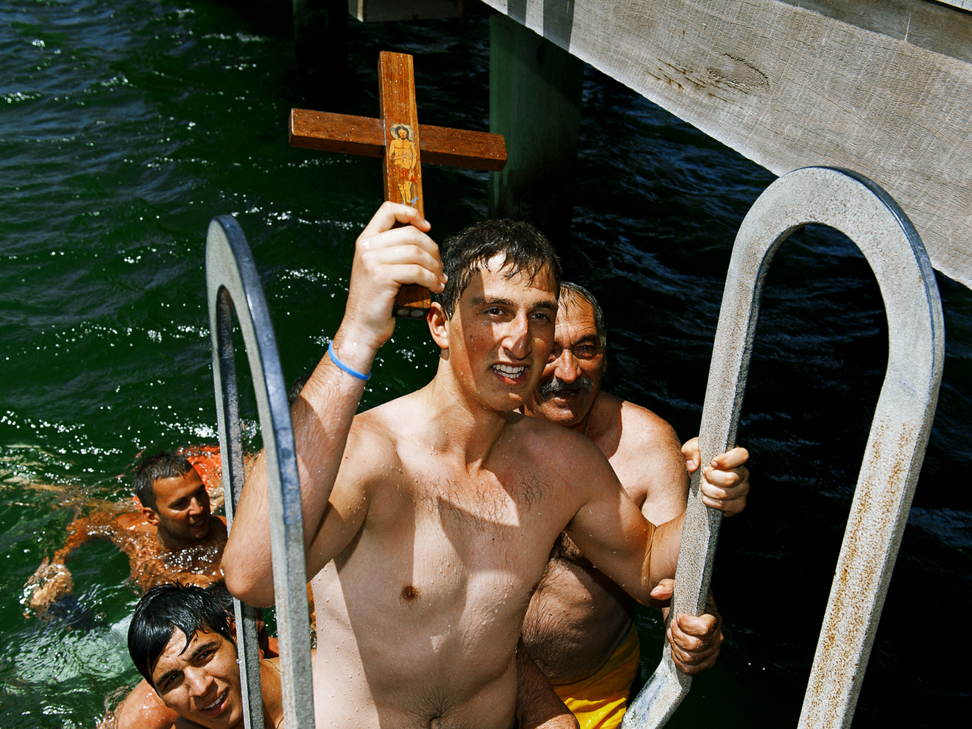 Young Man Retrieving Cross